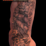 Black and gray ship rib tattoo
