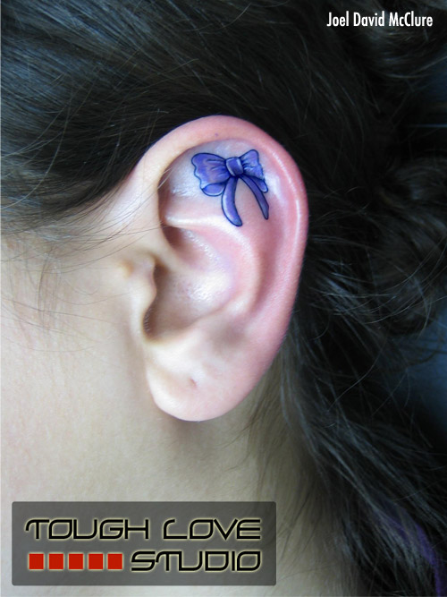 Bow ear tattoo
