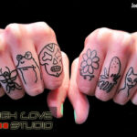 Cartoon finger tattoos