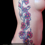 Cherry blossom rib tattoo