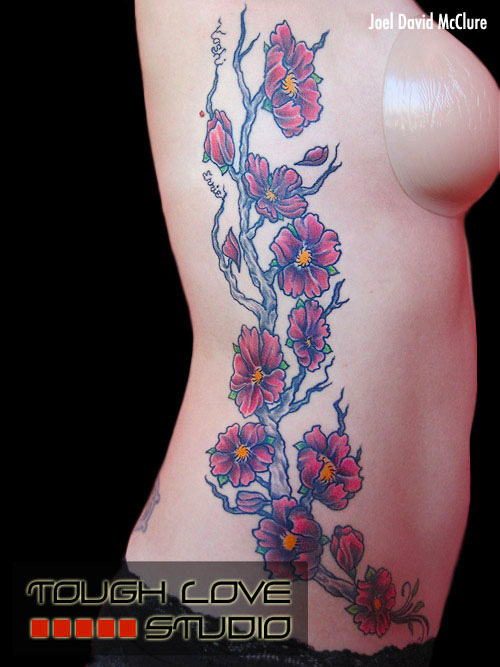 Cherry blossom rib tattoo