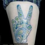 Paisley peace sign tattoo