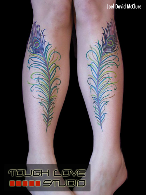 Matching peacock feather leg tattoos