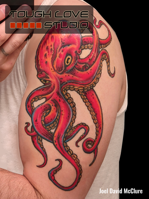 Red octopus arm tattoo