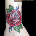 Red rose wrist tattoo