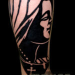 Virgin Mary silhouette tattoo