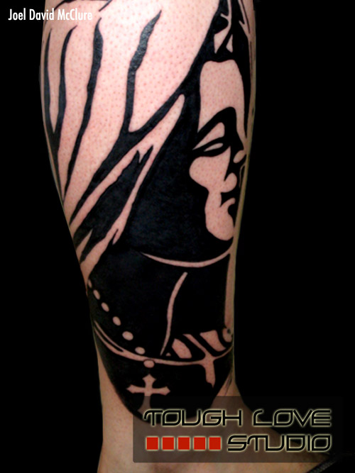 Virgin Mary silhouette tattoo